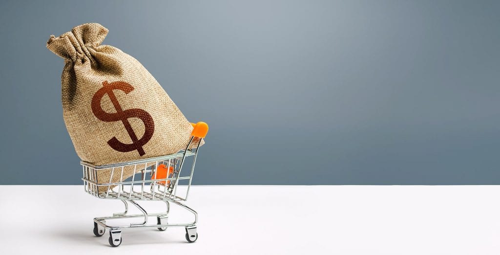 Dollar money bag on a shopping cart, consumer loan mortgage concept
